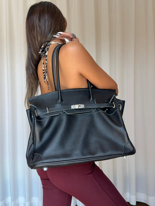 Black Leather Firkin Bag showing its classic tote silhouette and natural leather grain