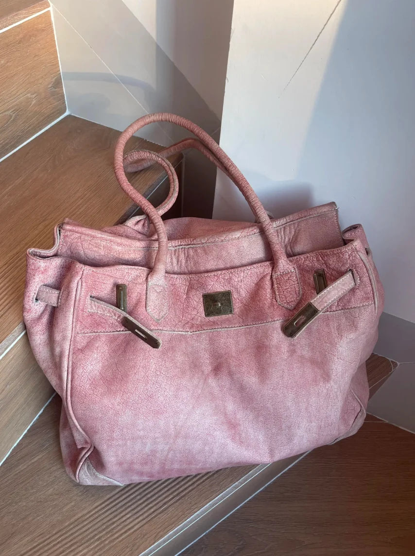 Front view of the Blossom pink washed leather Firkin tote bag with oversized silhouette and antique-tone hardware