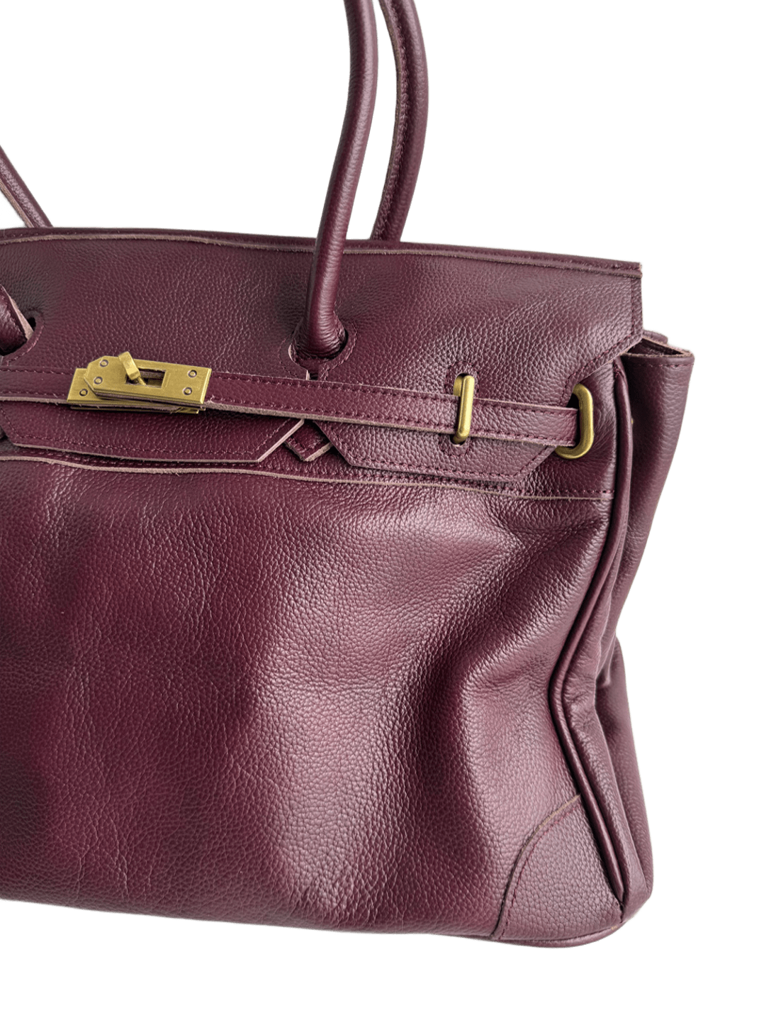 burgundy leather firkin bag side view with belt straps