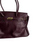 burgundy leather firkin bag turnlock clasp close-up