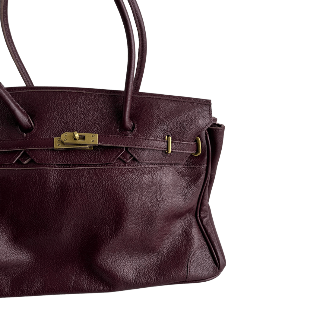 burgundy leather firkin bag turnlock clasp close-up