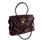 wine red leather firkin tote bag worn on shoulder