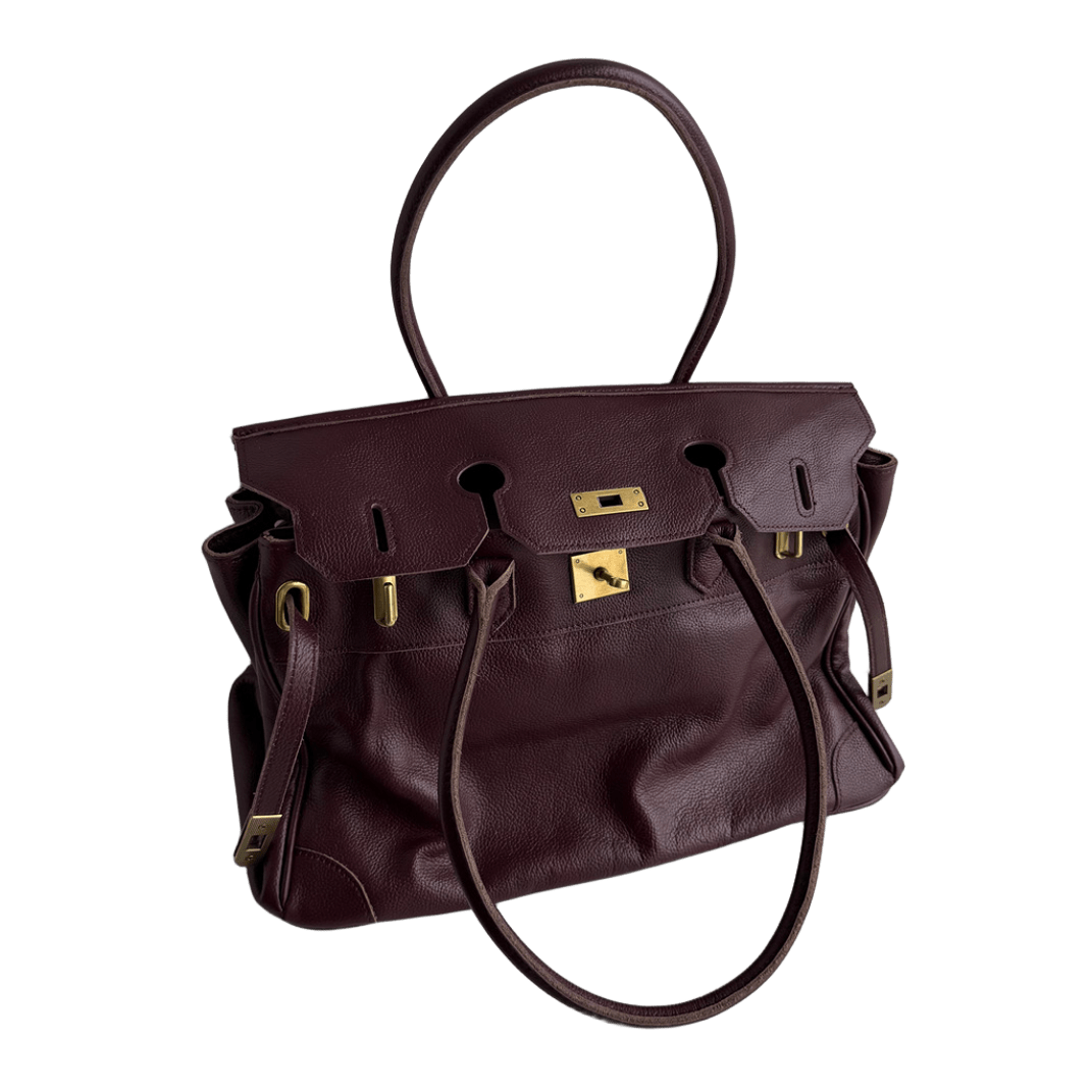 wine red leather firkin tote bag worn on shoulder