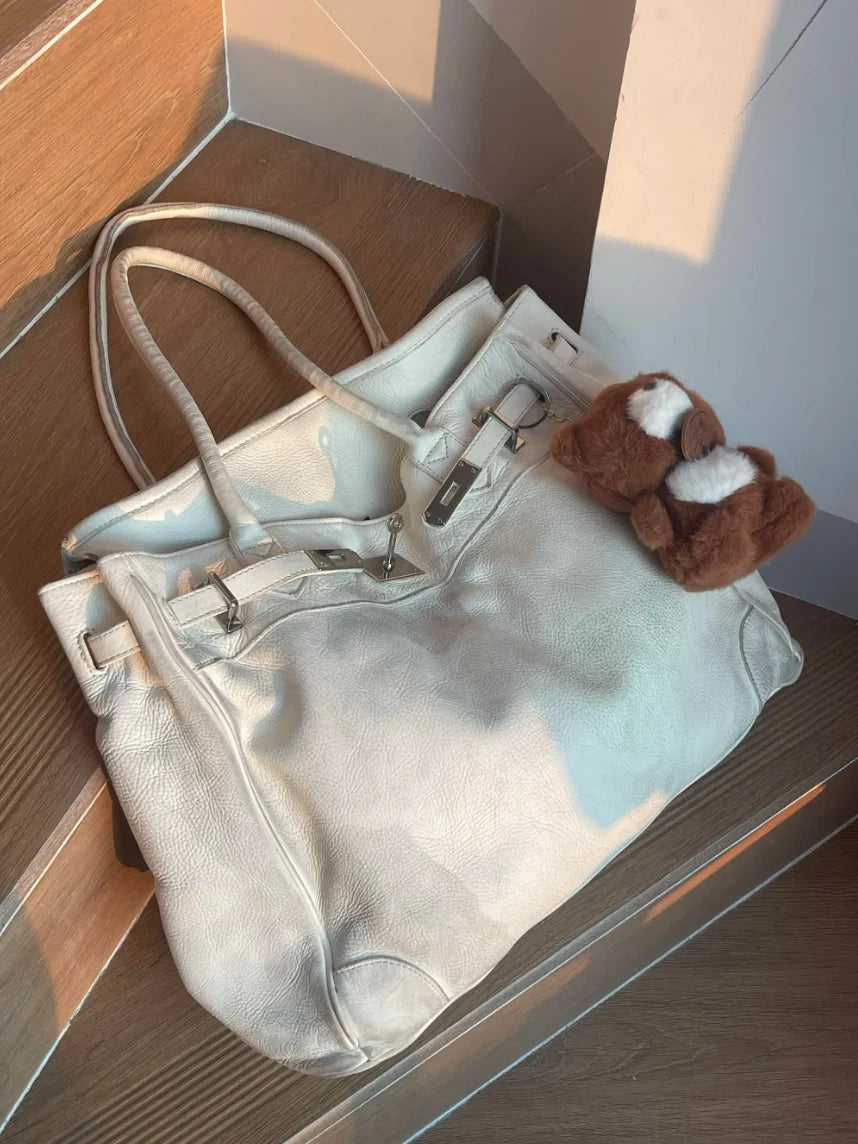 Close-up of the washed leather texture on the White Leather Firkin Bag