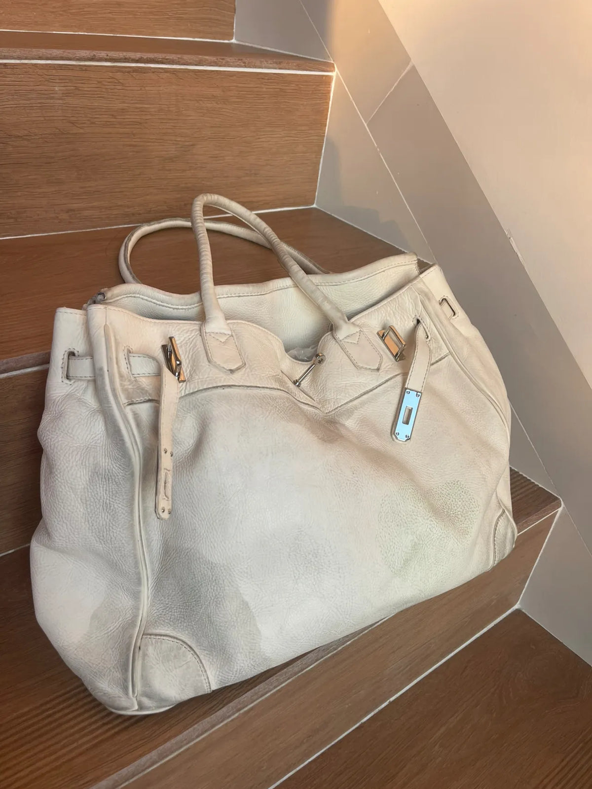Side view of the White Leather Firkin Bag 40 showing its structured tote silhouette